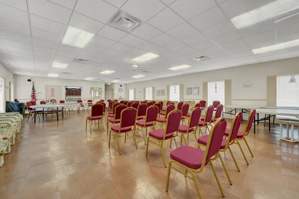 a kitchen with stainless steel appliances granite countertop a refrigerator and wooden cabinets