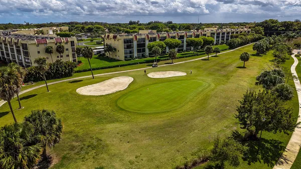 an aerial view of a residential houses and outdoor space