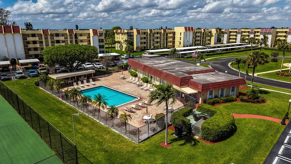 an aerial view of a pool yard swimming pool and outdoor seating