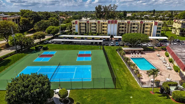 an aerial view of a house with a garden lake view