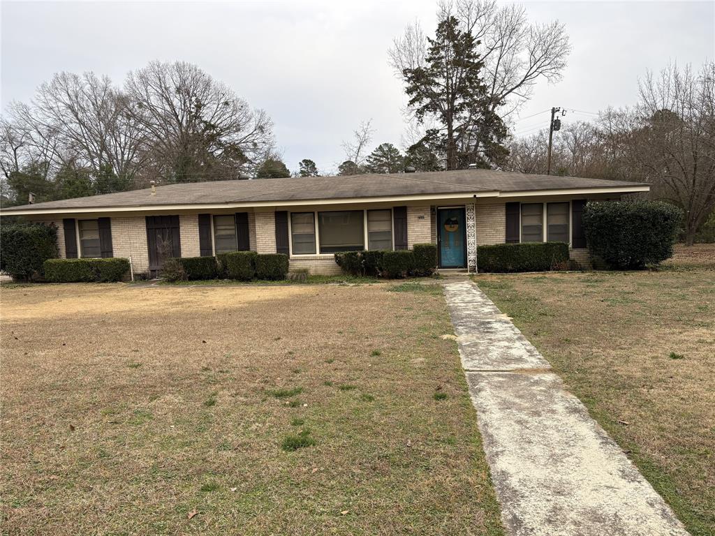 711 6th Street Northwest Springhill, LA 71075 - Photo 1 of 1 front view of a house with a yard