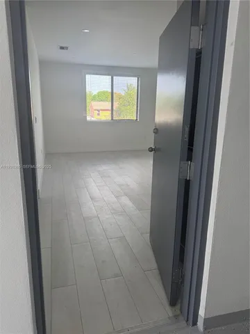 a view of an empty room and window