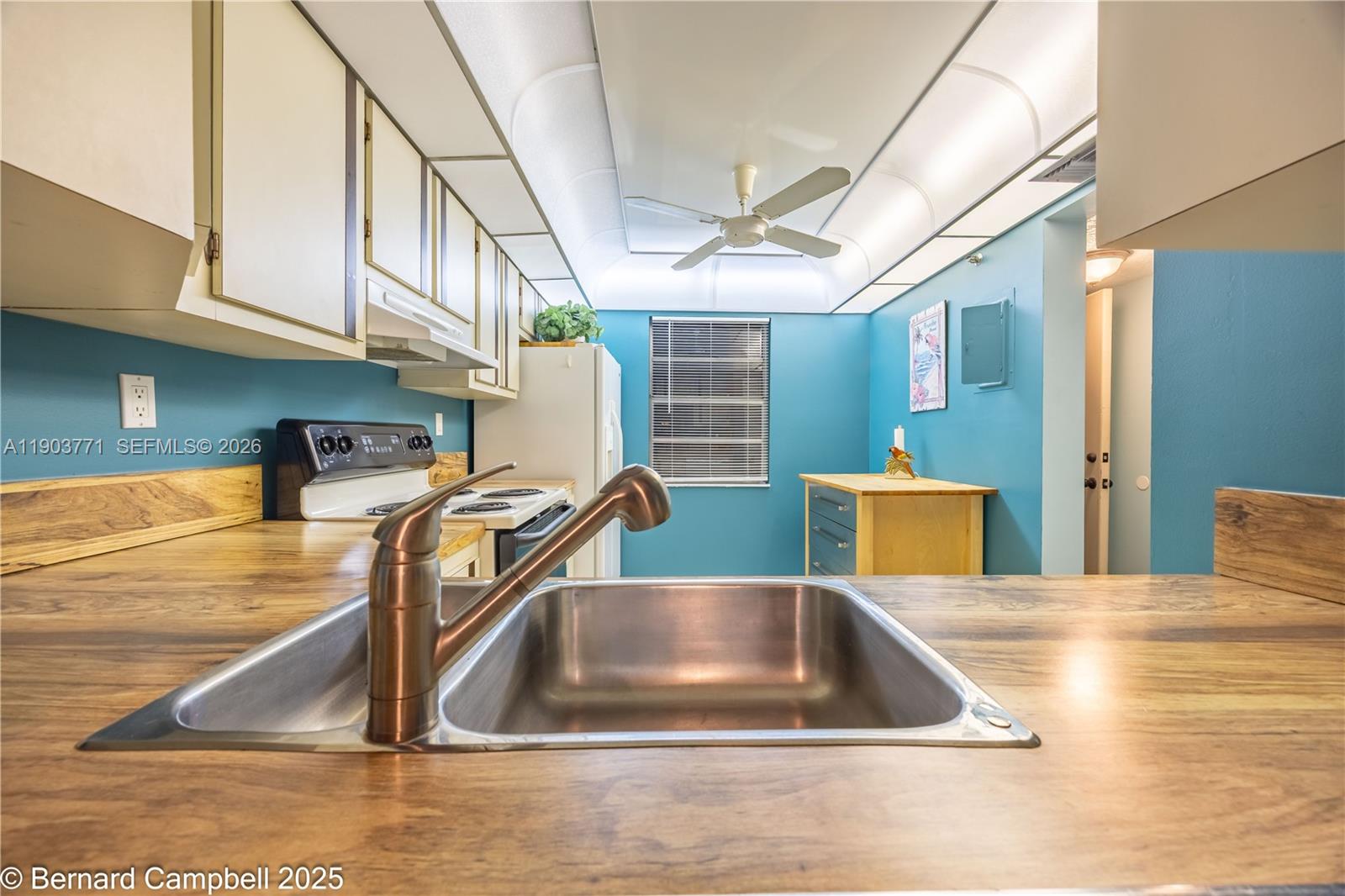 3910 Inverrary Boulevard, Unit 406B Lauderhill, FL 33319 - Photo 3 of 22 a view of a kitchen with appliances and a kitchen