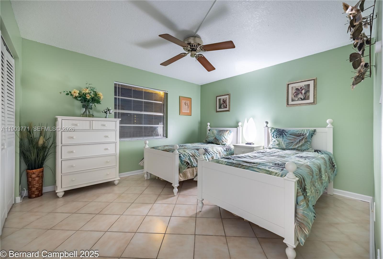 3910 Inverrary Boulevard, Unit 406B Lauderhill, FL 33319 - Photo 4 of 22 a bedroom with a bed and a cabinets