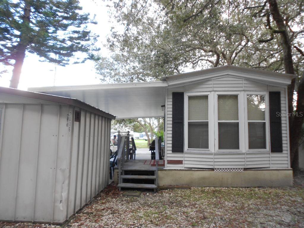 3000 Clarcona Road, Unit 2016 Apopka, FL 32703 - Photo 1 of 1 a view of a house and a yard