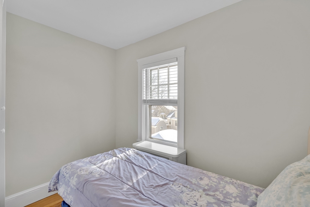 10 Dexter Road Lexington, MA 02420 - Photo 25 of 35 a bedroom with a bed and a window