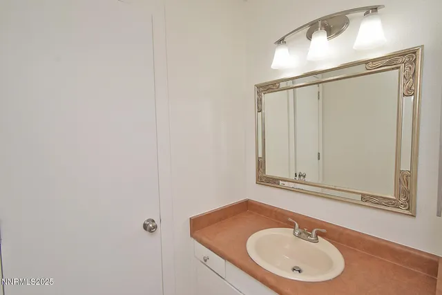 a white bath tub sitting next to a white toilet