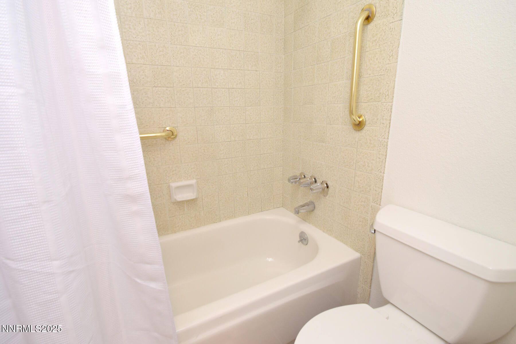 2750 Plumas Street, Unit 201 Reno, NV 89509 - Photo 31 of 34 a white bath tub sitting next to a white toilet