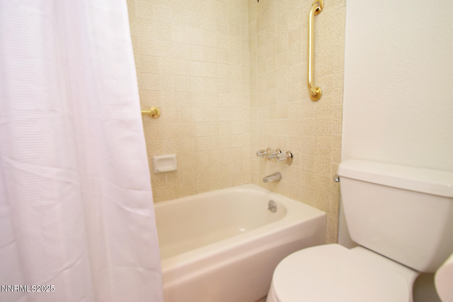 2750 Plumas Street, Unit 201 Reno, NV 89509 - Photo 32 of 34 a white bath tub sitting next to a white toilet