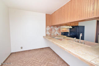 2750 Plumas Street, Unit 201 Reno, NV 89509 - Photo 8 of 34 a view of kitchen and wooden floor