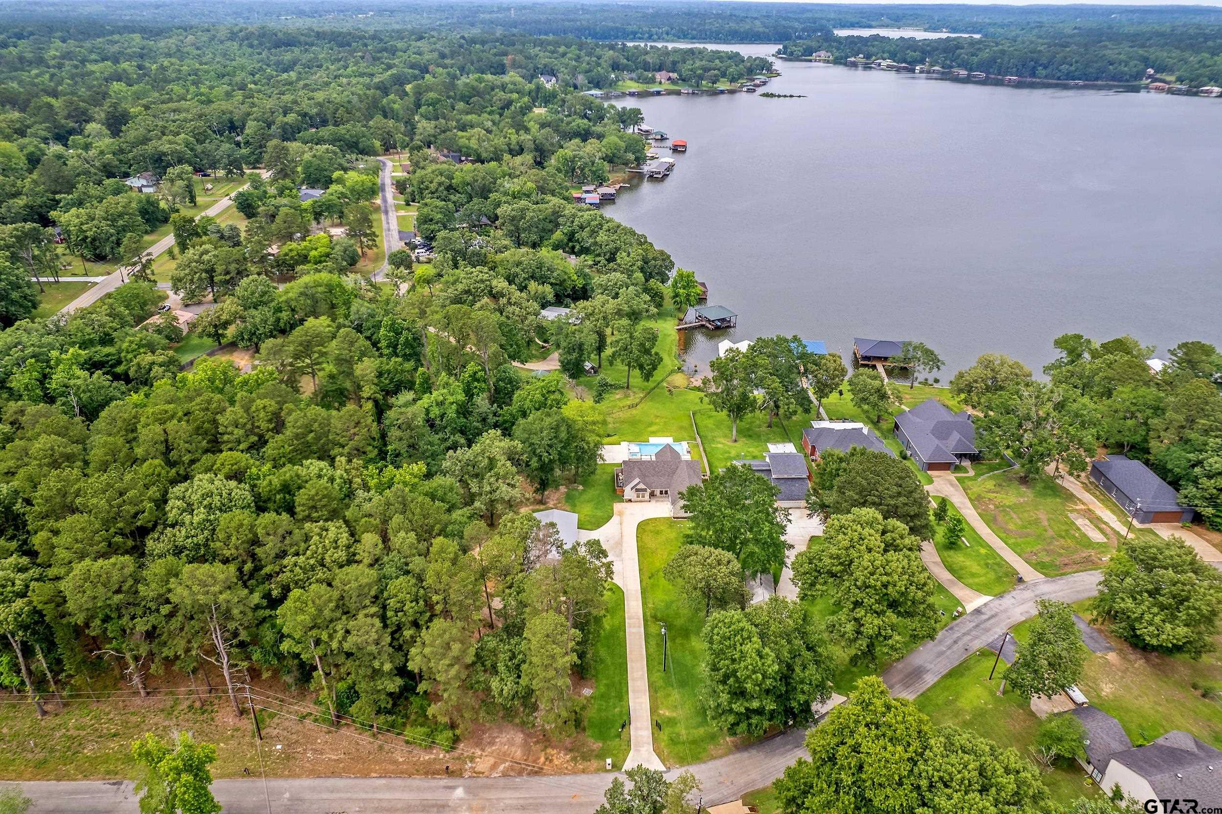 16837 Wilson Road Tyler, TX 75707 - Photo 9 of 44 a view of a lake with a house