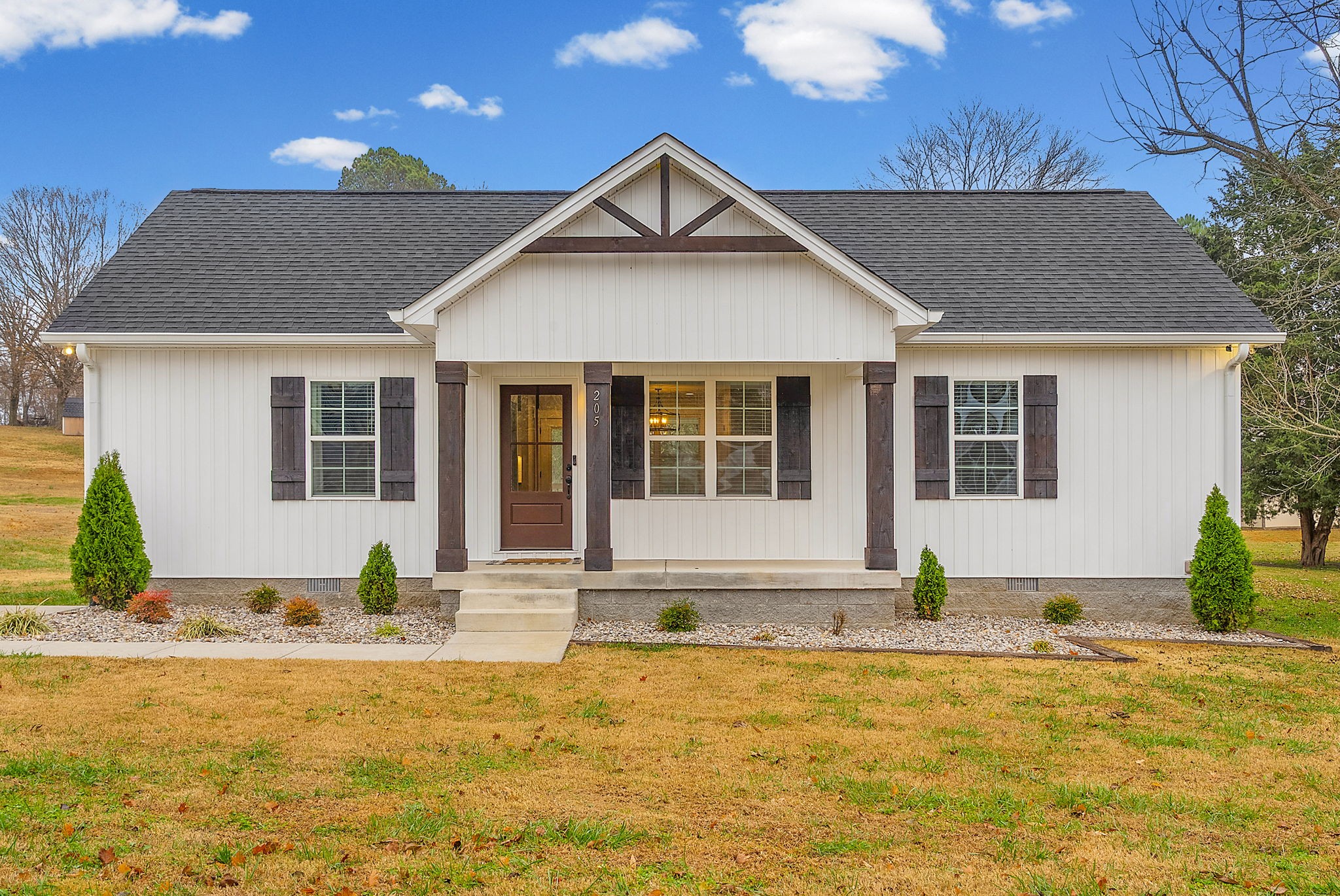 a front view of a house with a yard