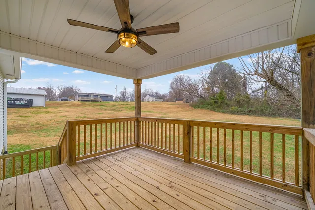 a view of a balcony with wooden floor