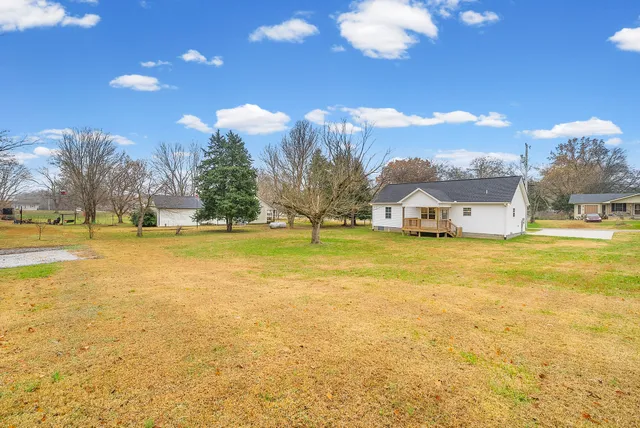 a view of a swimming pool with an outdoor space and seating area