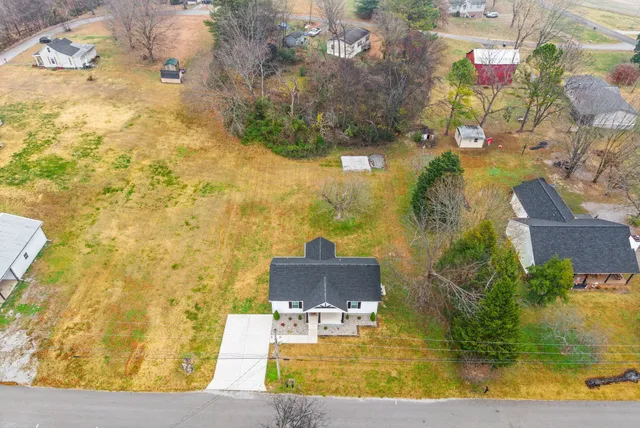 a view of a swimming pool with an outdoor seating area
