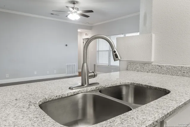 a close view of a sink and chandelier