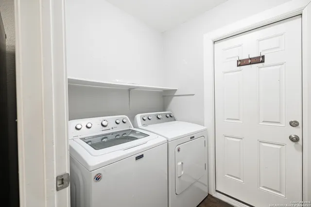 a utility room with dryer and washer