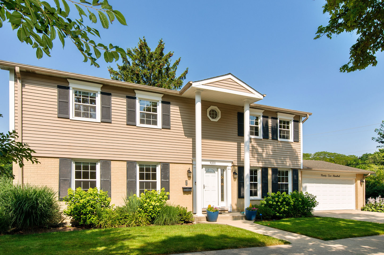 9200 Ridgeway Avenue Evanston, IL 60203 - Photo 2 of 33 a front view of a house with a yard