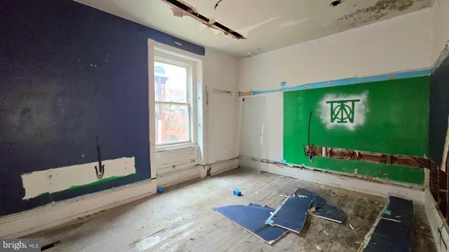 a view of a hallway to rooms