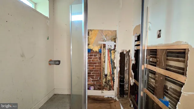 a room with gym equipment and a large window