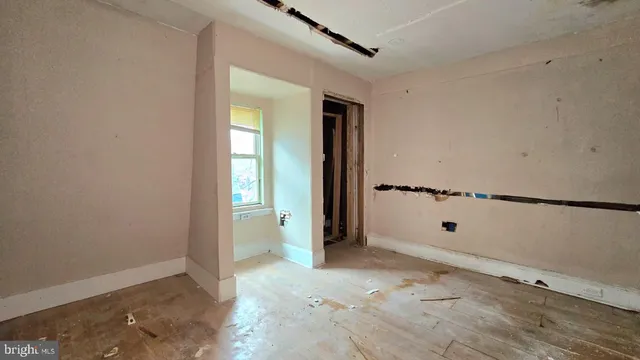 a brick building with a tree in front of it