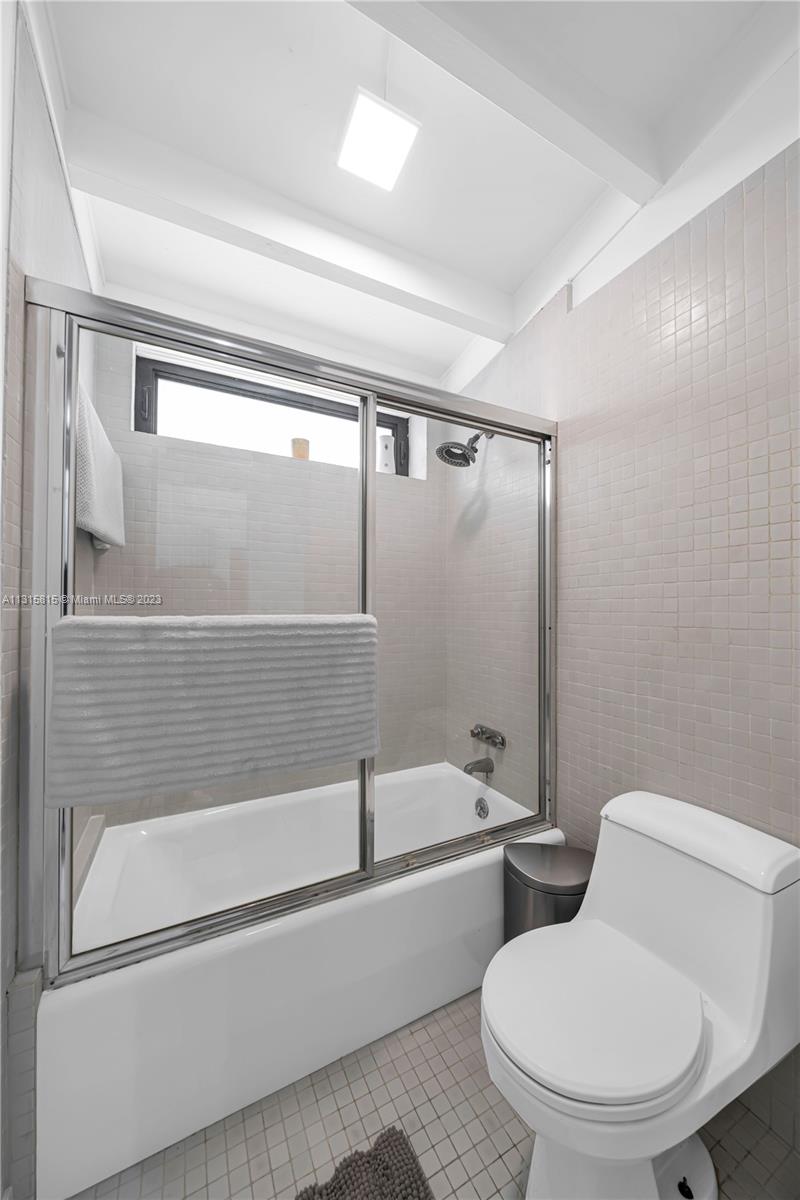 141 Southwest 24th Road Miami, FL 33129 - Photo 23 of 58 a bathroom with a toilet bathtub and shower