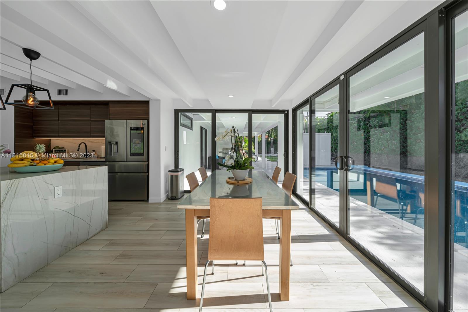 141 Southwest 24th Road Miami, FL 33129 - Photo 3 of 58 a lobby with furniture and floor to ceiling window