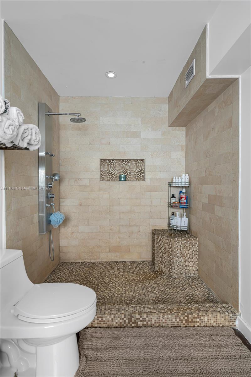 141 Southwest 24th Road Miami, FL 33129 - Photo 34 of 58 a bathroom with a toilet and a shower