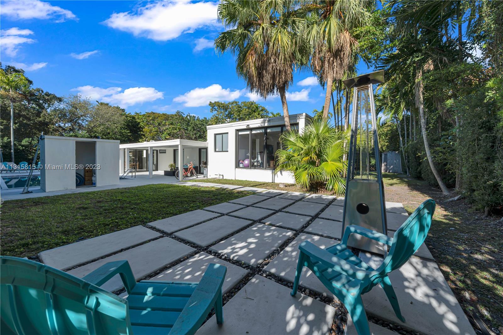 141 Southwest 24th Road Miami, FL 33129 - Photo 54 of 58 a view of a house with backyard and sitting area