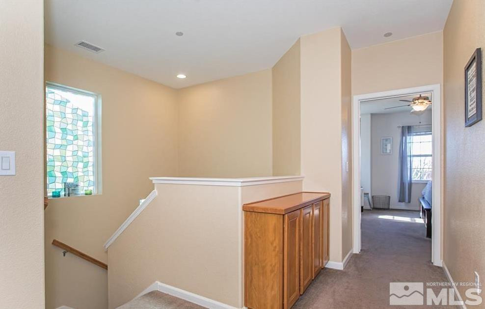 6923 Sacred Circle Sparks, NV 89436 - Photo 13 of 16 a view of hallway with wooden floor