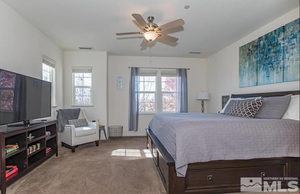 6923 Sacred Circle Sparks, NV 89436 - Photo 14 of 16 a living room with furniture and a flat screen tv