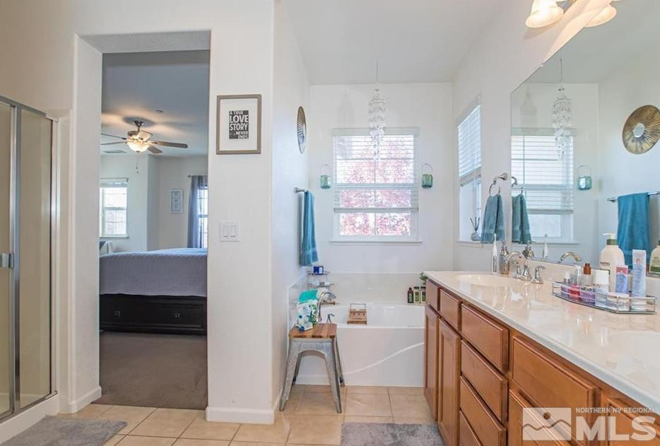 6923 Sacred Circle Sparks, NV 89436 - Photo 15 of 16 a spacious bathroom with a sink double vanity and a mirror