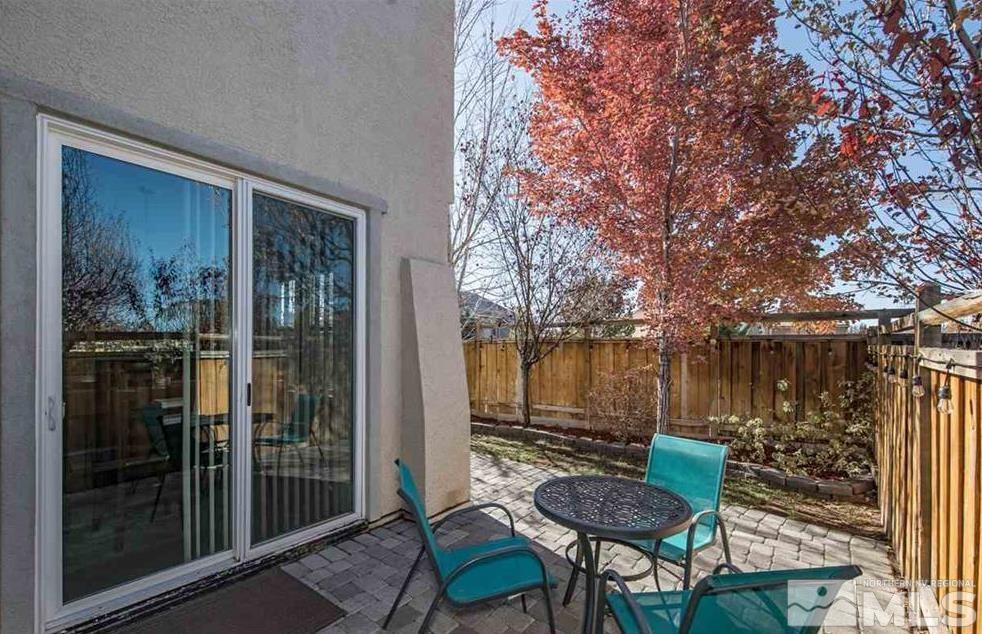 6923 Sacred Circle Sparks, NV 89436 - Photo 2 of 16 a view of a balcony with chairs and a table