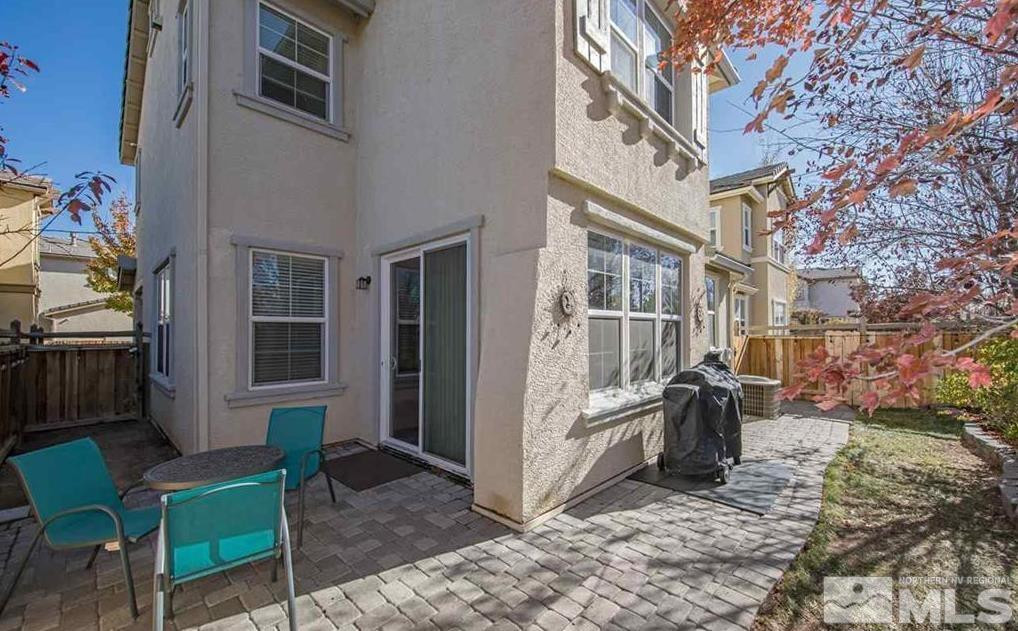 6923 Sacred Circle Sparks, NV 89436 - Photo 3 of 16 a view of a brick buildings with many windows