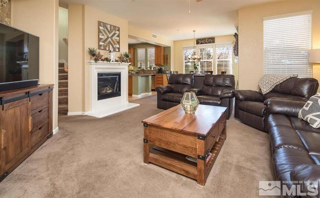 6923 Sacred Circle Sparks, NV 89436 - Photo 6 of 16 a living room with furniture and a fireplace