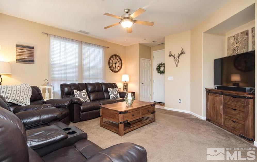 6923 Sacred Circle Sparks, NV 89436 - Photo 7 of 16 a living room with furniture and a flat screen tv