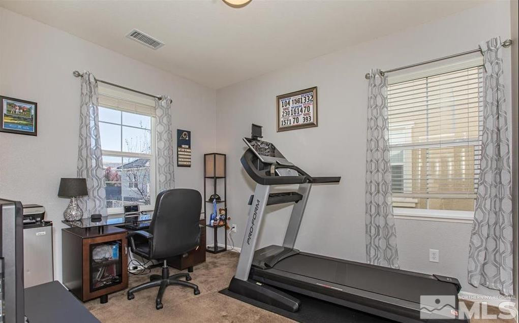 6923 Sacred Circle Sparks, NV 89436 - Photo 10 of 16 a view of a workspace with furniture and a window