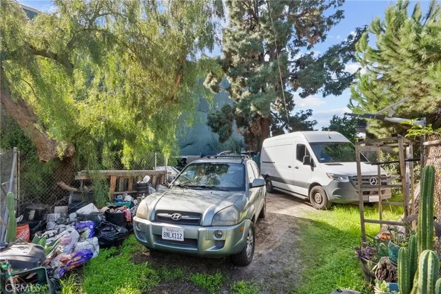 a front view of a house with a yard and a garage