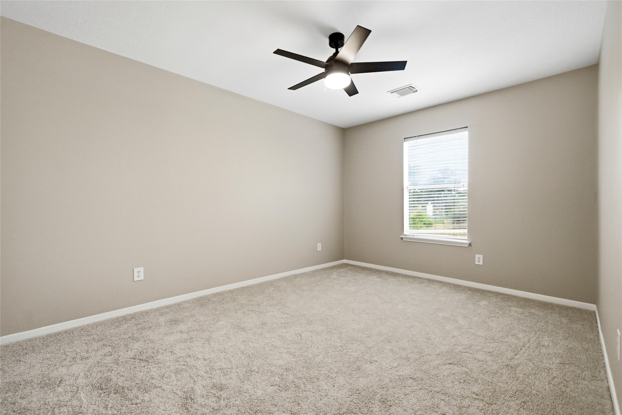 3711 Slocom Drive Katy, TX 77449 - Photo 36 of 46 an empty room with a window and a fan