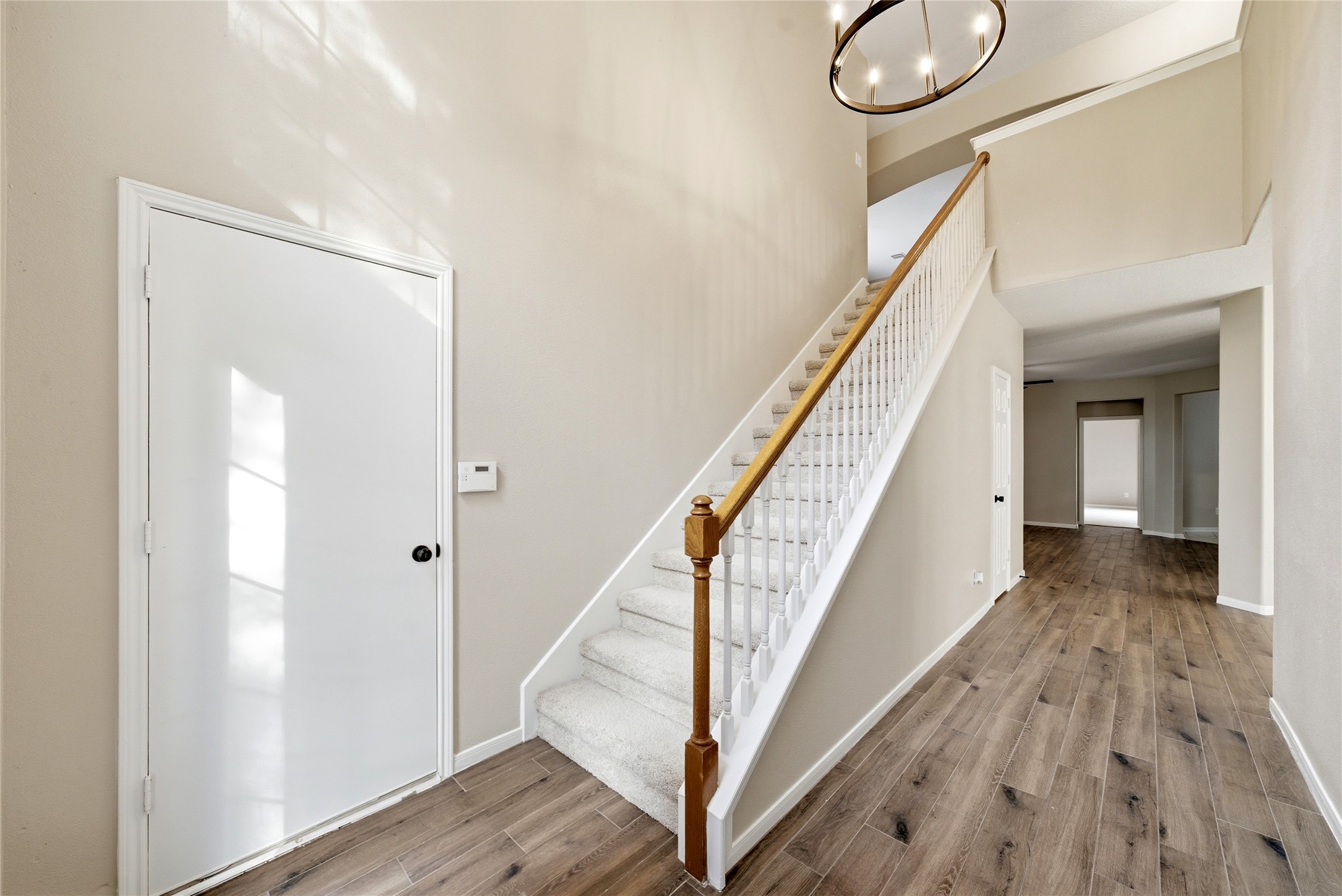 3711 Slocom Drive Katy, TX 77449 - Photo 5 of 46 a view of a hallway with wooden floor and staircase