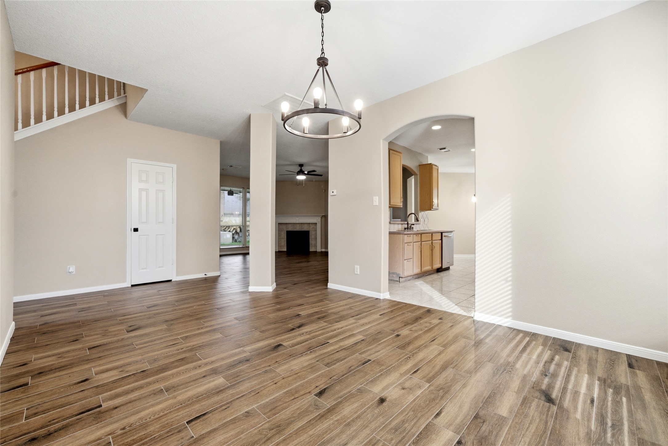 3711 Slocom Drive Katy, TX 77449 - Photo 8 of 46 a view of a livingroom with wooden floor and a kitchen space