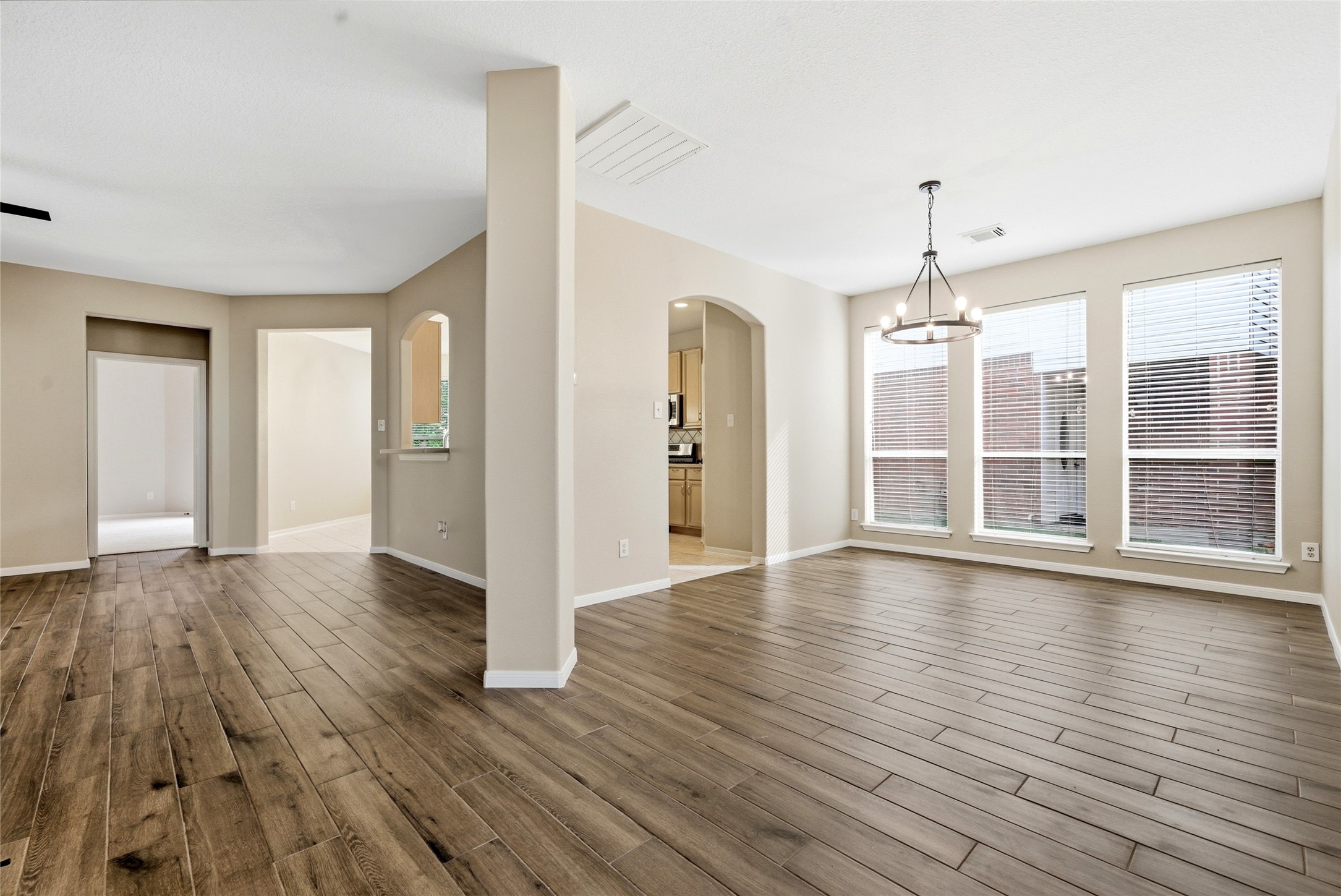 3711 Slocom Drive Katy, TX 77449 - Photo 9 of 46 a view of empty room with wooden floor and window