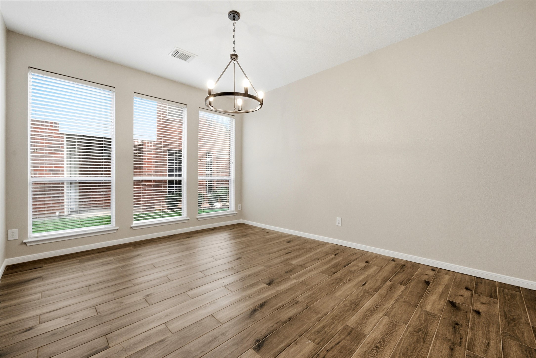 3711 Slocom Drive Katy, TX 77449 - Photo 10 of 46 a view of empty room with wooden floor and fan