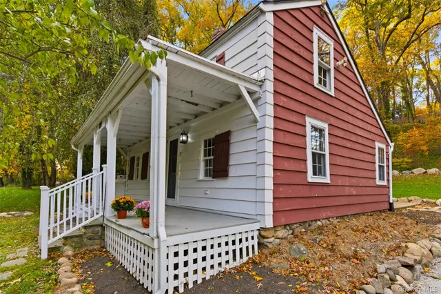 a view of a house with wooden fence