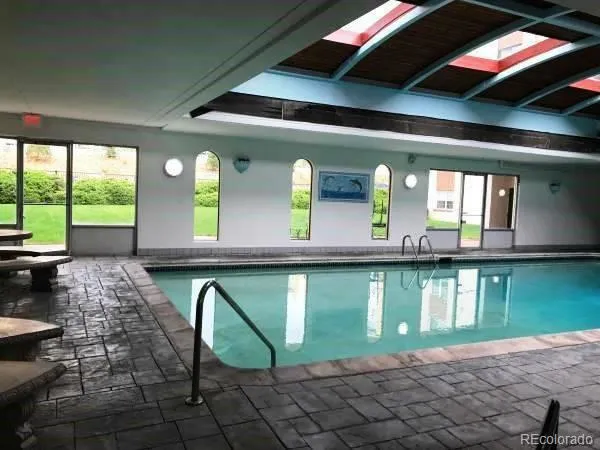 a view of swimming pool with outdoor seating