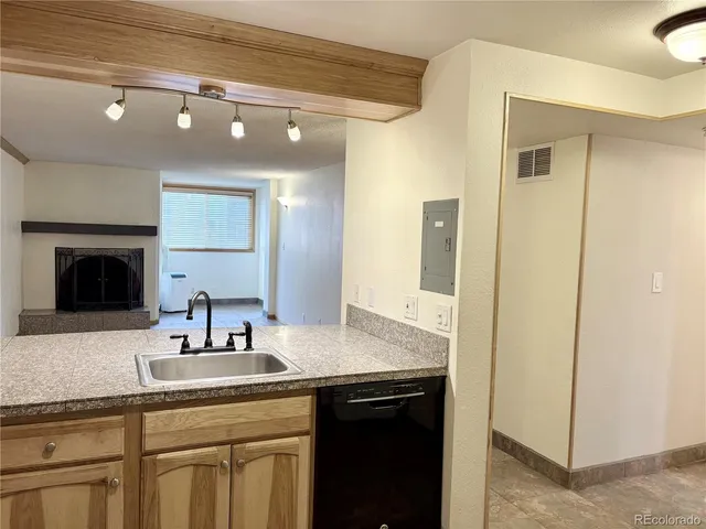 a bathroom with a granite countertop sink a mirror and a vanity