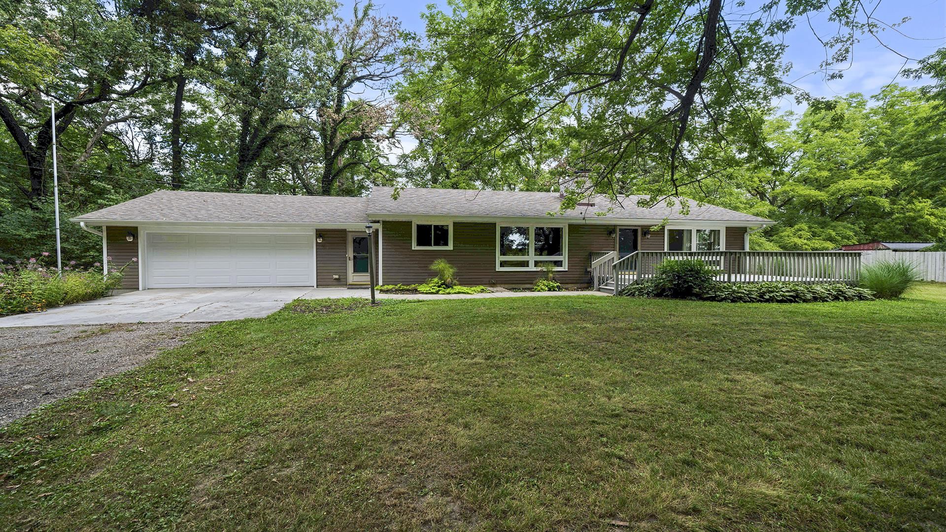 3691 South Bend Road Rockford, IL 61109 - Photo 1 of 34 a front view of a house with a yard and green space