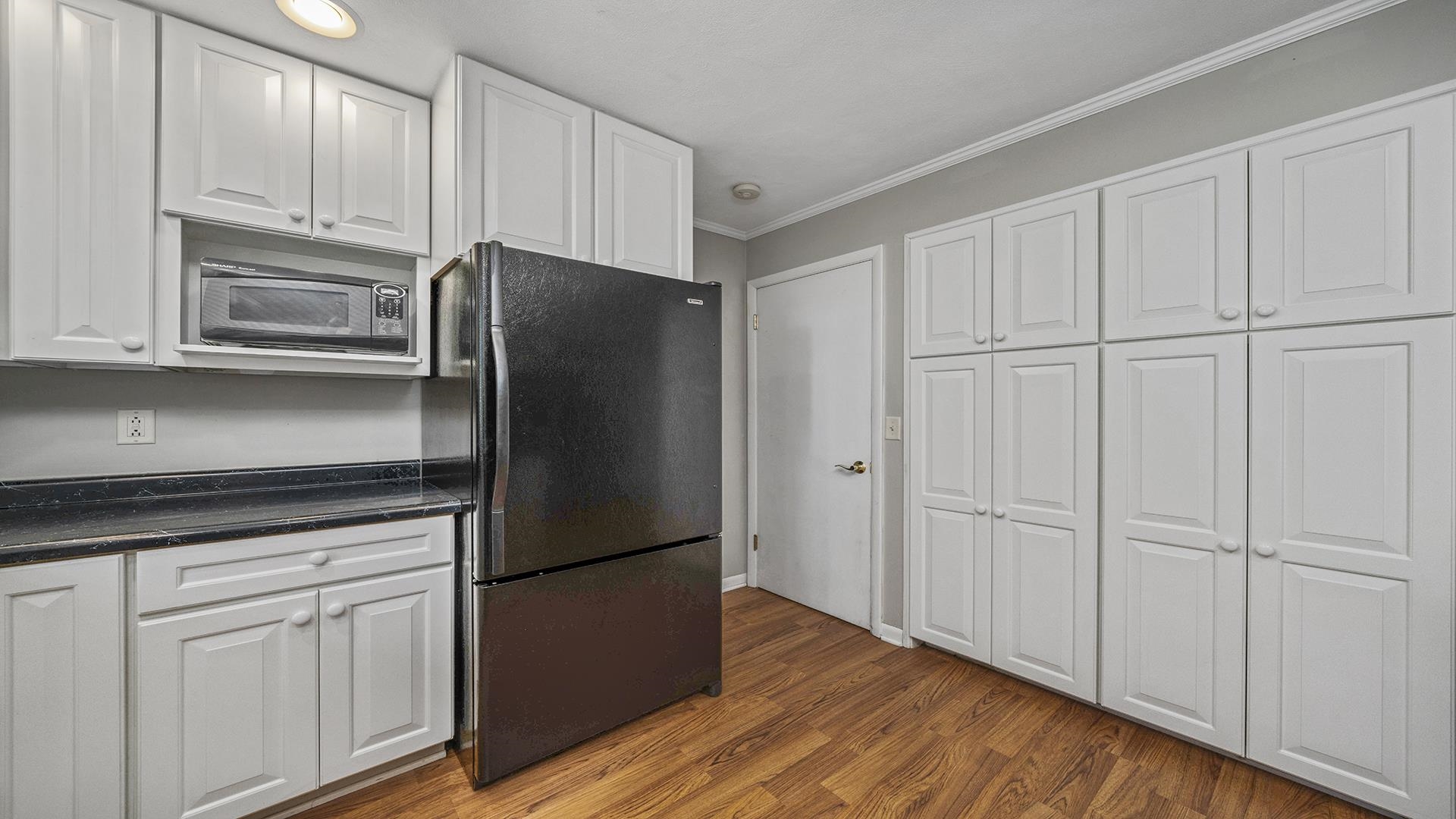 3691 South Bend Road Rockford, IL 61109 - Photo 11 of 34 a kitchen with stainless steel appliances granite countertop white cabinets and refrigerator
