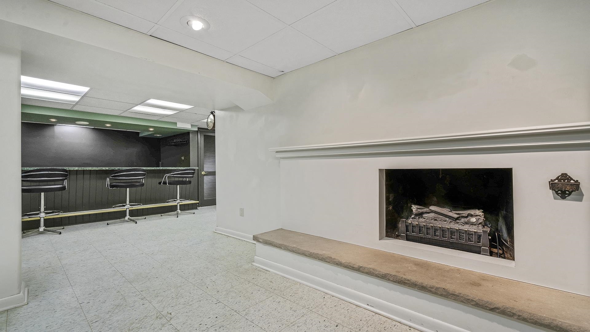 3691 South Bend Road Rockford, IL 61109 - Photo 19 of 34 a living room with a flat screen tv and a fireplace