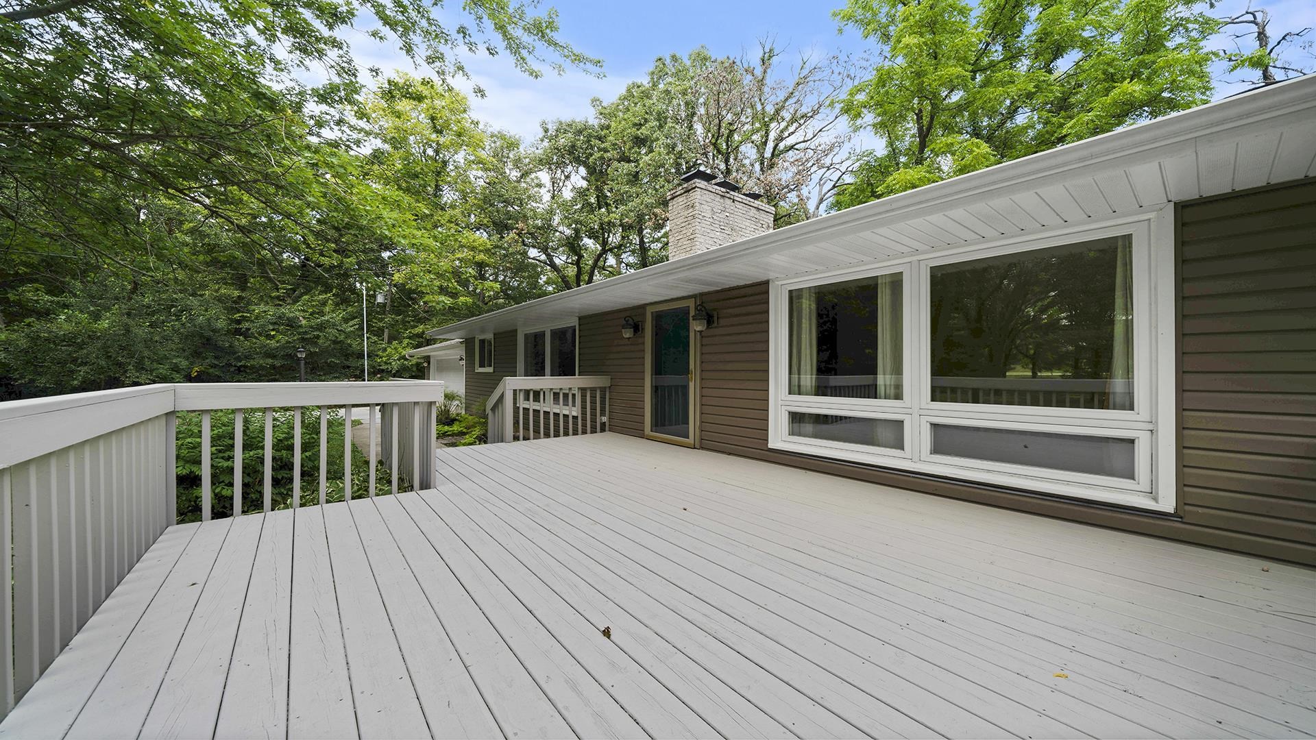 3691 South Bend Road Rockford, IL 61109 - Photo 29 of 34 a view of backyard with deck and wooden floor